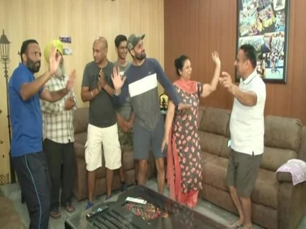 Family of hockey players celebrate India's bronze medal win at Tokyo Olympics - https://cdn.connectfm.ca/Hockey-Jalandhar.jpg