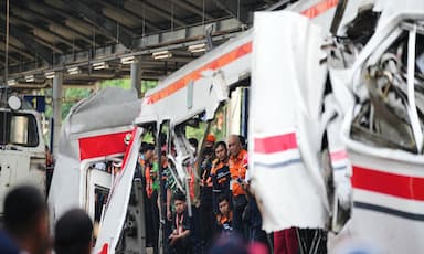 rescuers-work-to-reach-three-trapped-after-fatal-train-crash-near-jakarta