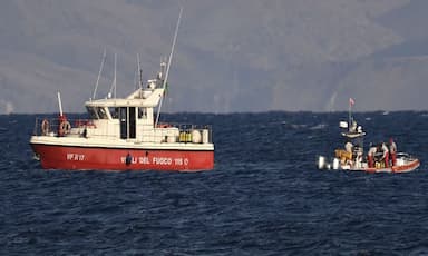 rescue-crews-unload-body-bag-in-sicily-port-as-search-continues-after-yacht-sinking