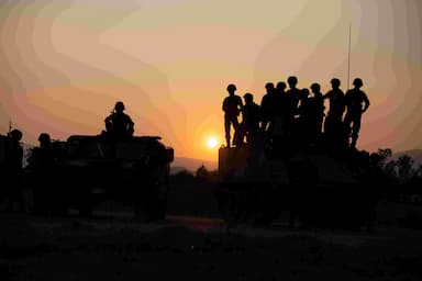 strike-on-palestinians-waiting-for-aid-in-gaza-kills-and-wounds-dozens