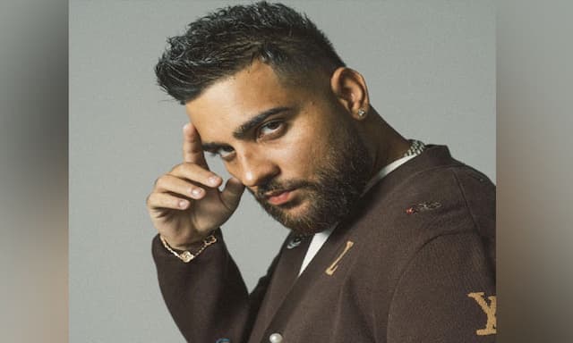Karan Aujla Controversy Sparks Heated War of Words in Punjabi Music Industry - https://cdn.connectfm.ca/karan-aoujla_2024-06-26-173215_mdul.jpg