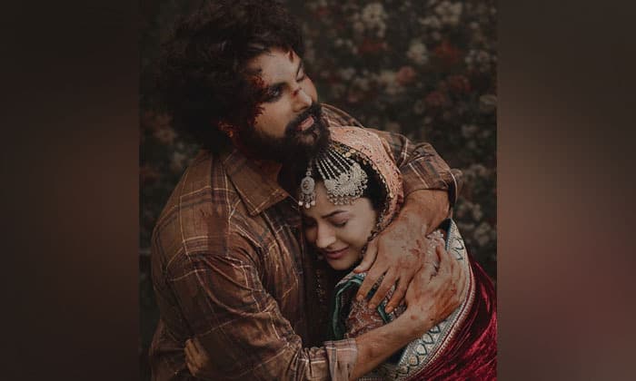 shehnaaz-gill-embraces-bloodied-jayy-randhawa-in-intense-first-look-of-ishqnama