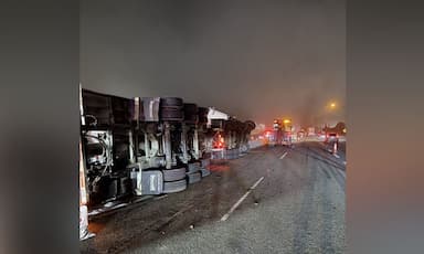 grain-laden-semi-truck-overturns-on-highway-1-in-abbotsford-causing-major-traffic-delays